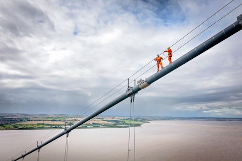 Bridge Workers Working on Cable of a Suspension Bridge